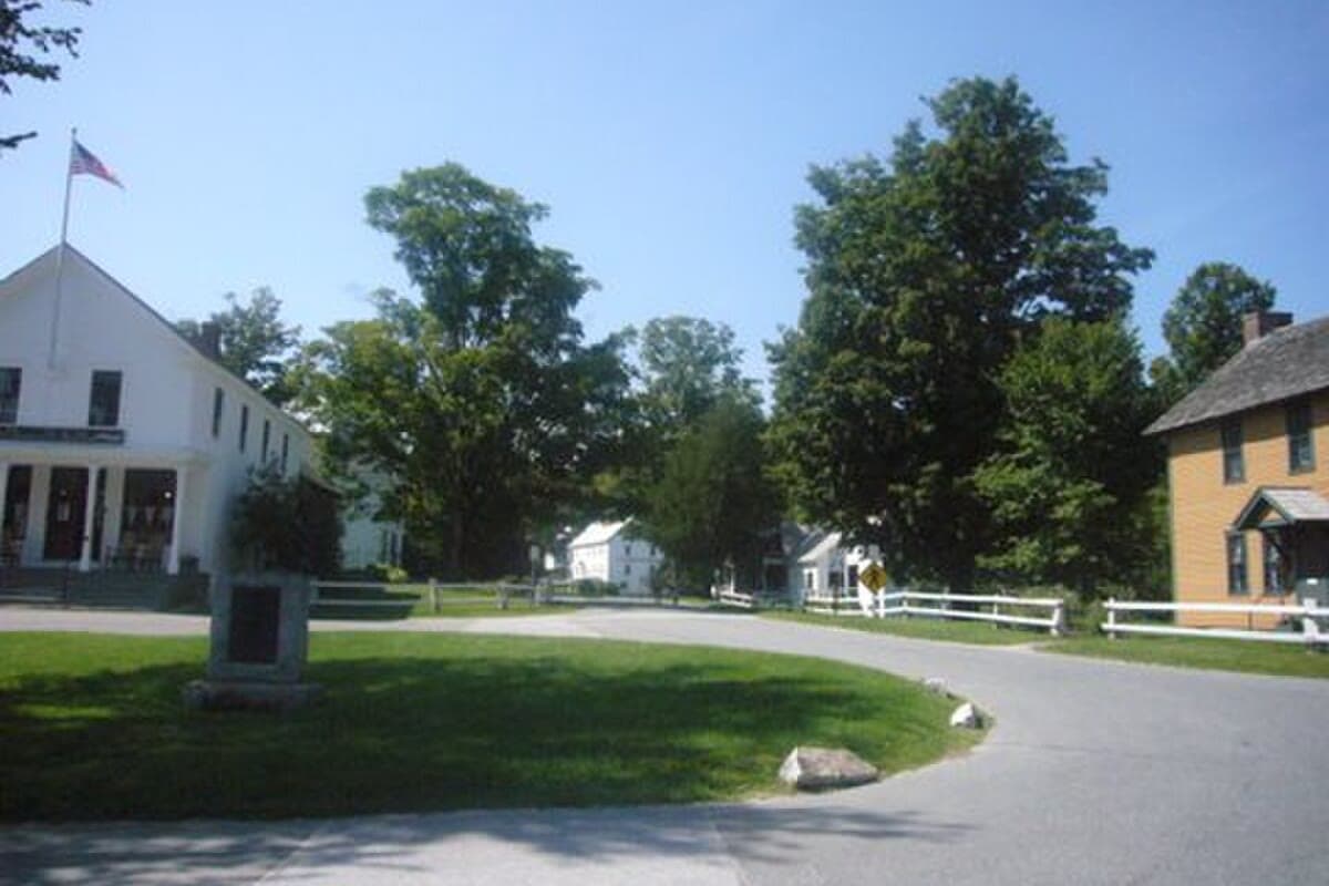 Plymouth Notch village green in Vermont with white clapboard buildings and green lawns