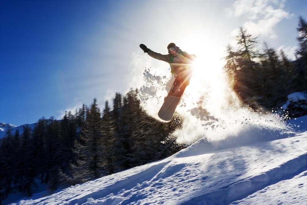 Snowboarder catching air at the KParks Spring Send-Off at Killington