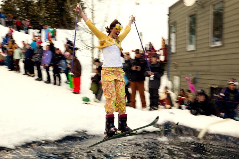 Skier attempting to cross the pond at Killington's annual Pond Skim event