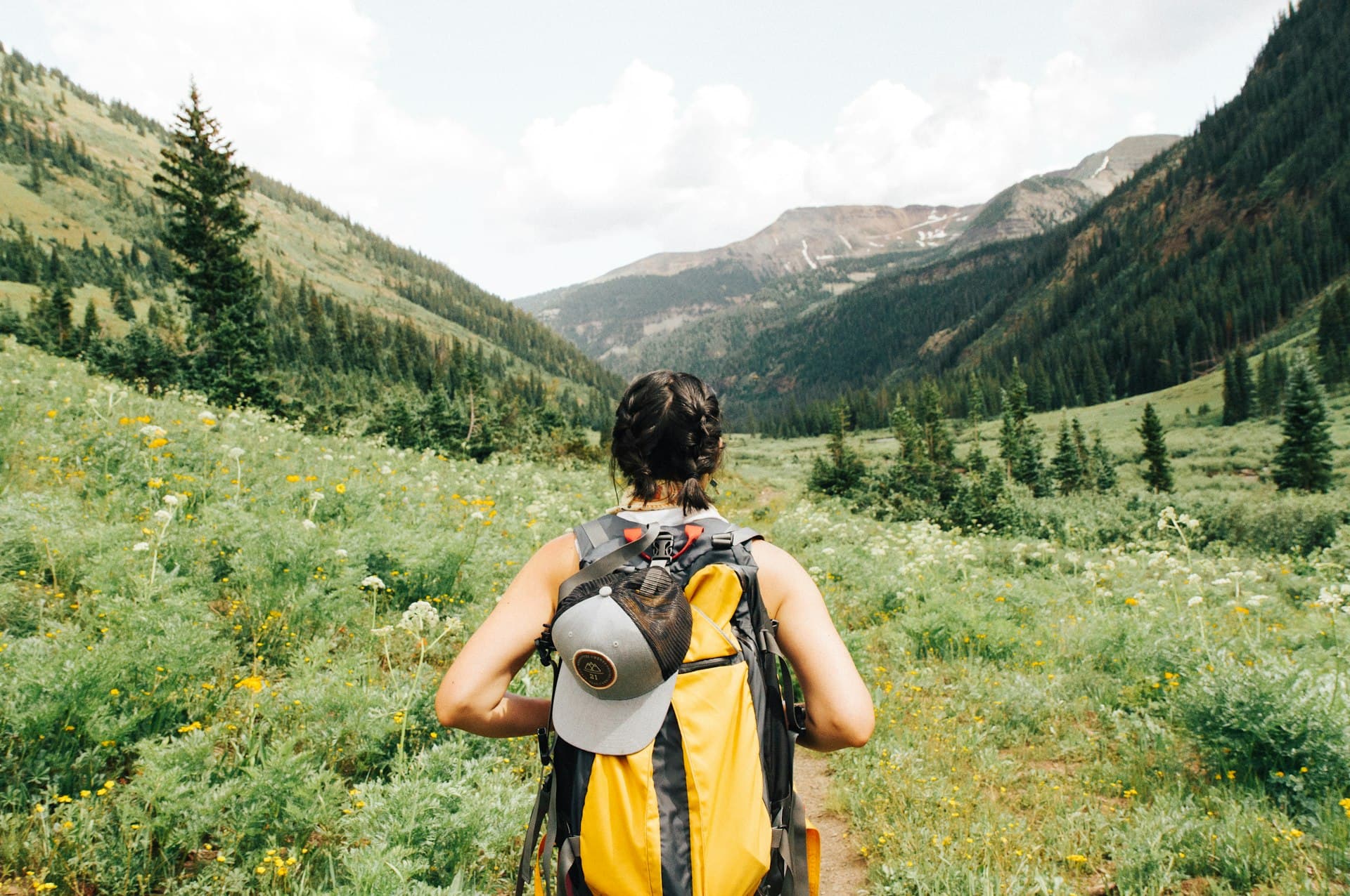 Hiker on alpine trail with mountain views near Killington, Vermont