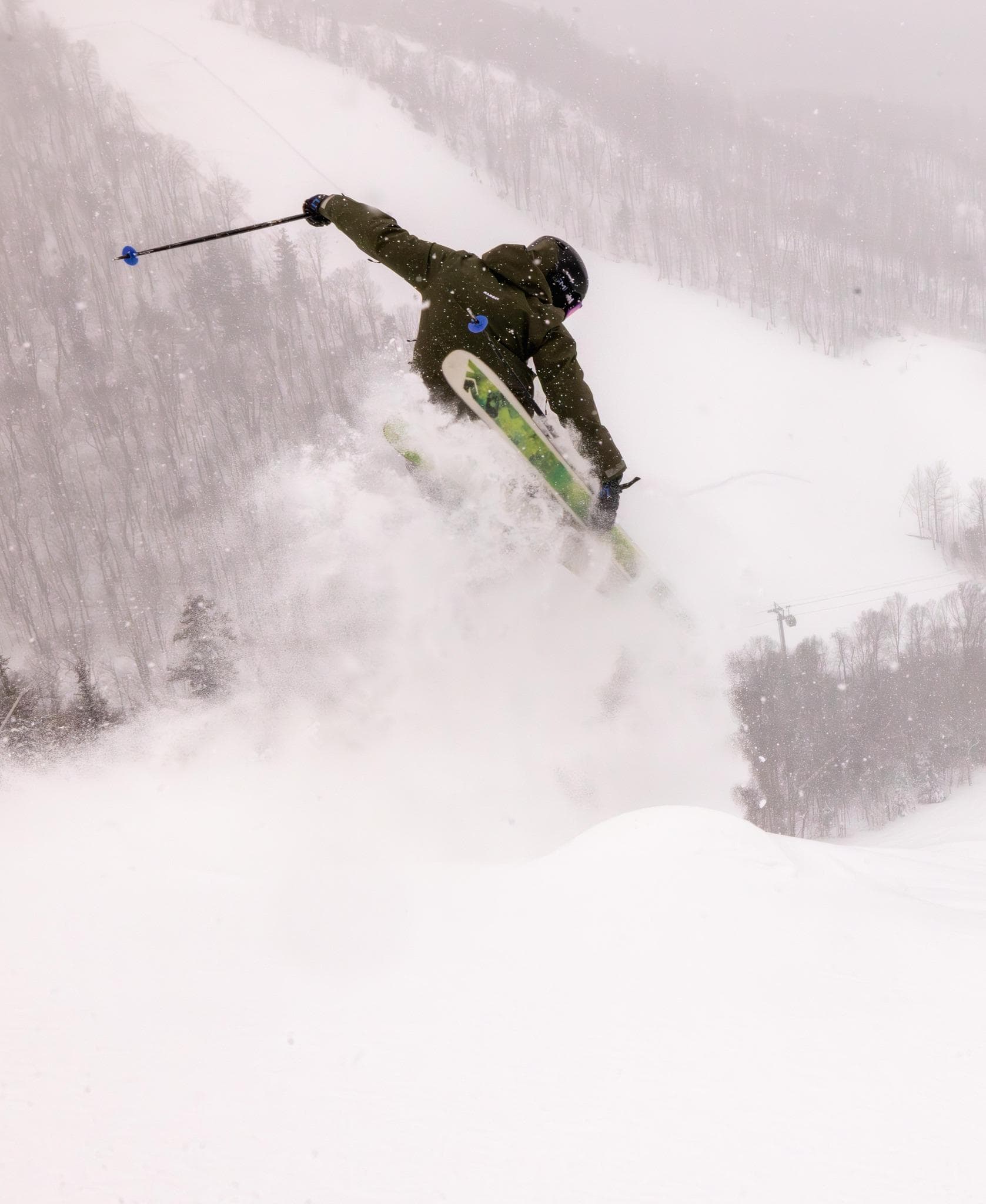 Skier jumping in powder snow