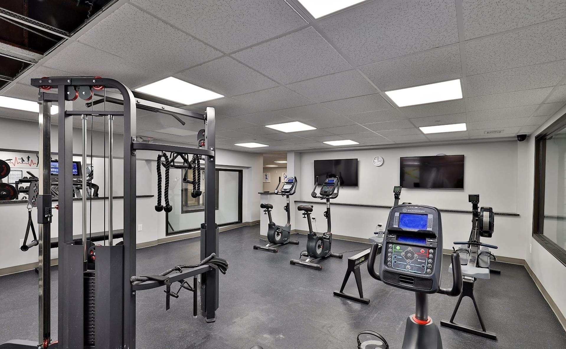 Fitness room with cable machines and bikes
